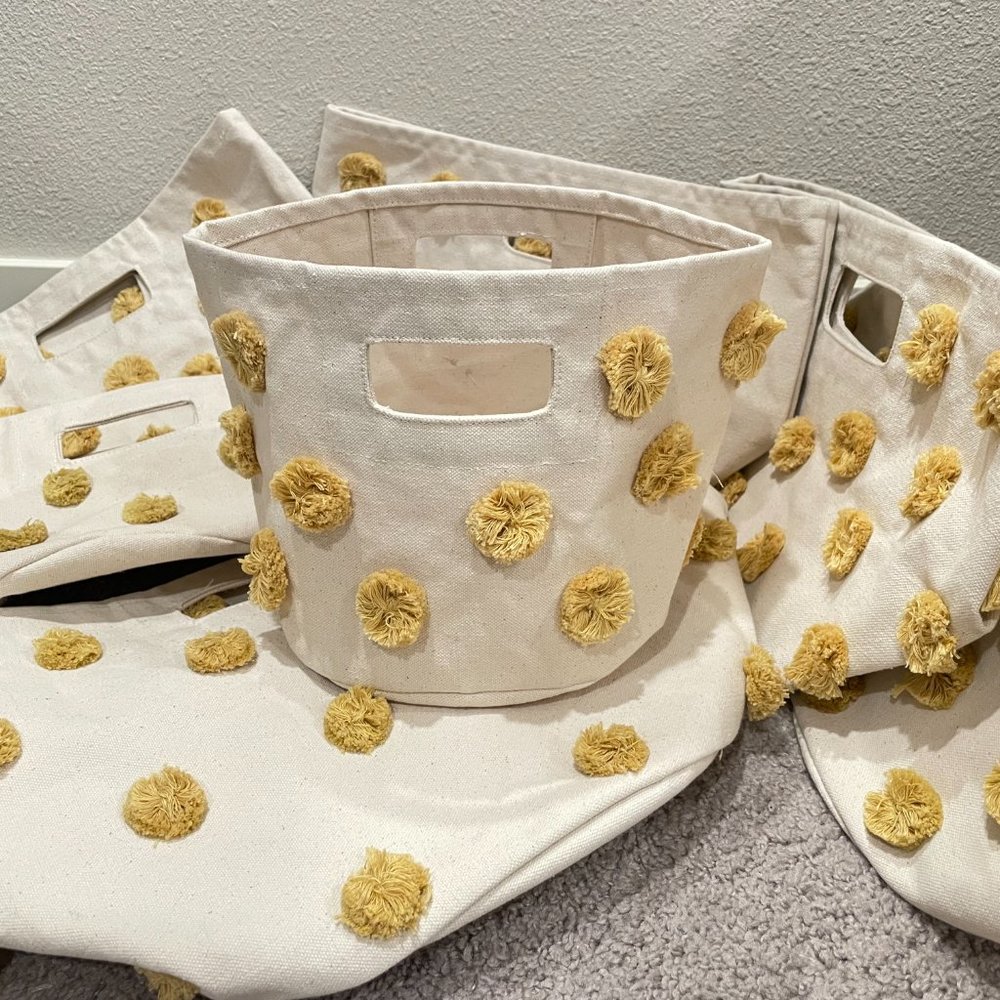 Set of 7 Pehr Cotton Bins Baskets with Marigold Yellow Pom Poms